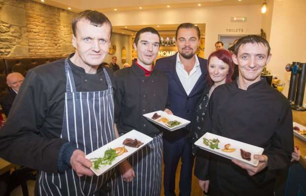 Social Bite handout photo of Oscar winning actor and environmentalist Leonardo DiCaprio with (left to right) Colin Childs, Joe Hart, Biffy Mackay and Sonny Murray as he visits Home by Social Bite, a new restaurant in Edinburgh which was set up to provide food, training and employment opportunities for homeless people in Scotland.  PRESS ASSOCIATION Photo. Issue date: Thursday November 17, 2016. See PA story SHOWBIZ DiCaprio. Photo credit should read: Jeff Holmes/Social Bite/PA Wire NOTE TO EDITORS: This handout photo may only be used in for editorial reporting purposes for the contemporaneous illustration of events, things or the people in the image or facts mentioned in the caption. Reuse of the picture may require further permission from the copyright holder.