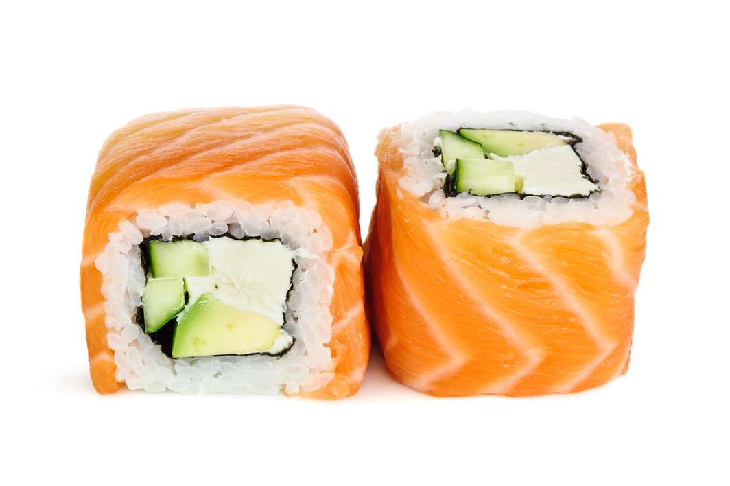 Uramaki maki sushi, two rolls isolated on white. Salmon with philadelphia, avocado and cucumber